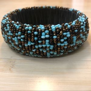 Bracelets turquoise-brown over wood, Size O/S